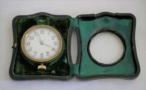 A spectacularly rare antique (1911) Hallmarked sterling silver travel clock w/ a Brevet 33236 watch