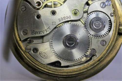 A spectacularly rare antique (1911) Hallmarked sterling silver travel clock w/ a Brevet 33236 watch