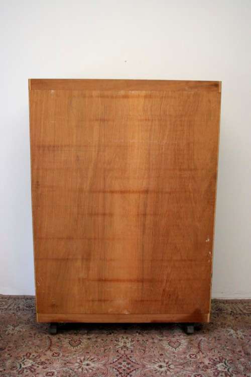 A stunning Imbuia-finished double door wardrobe with hand carved rosettes and facade detailing