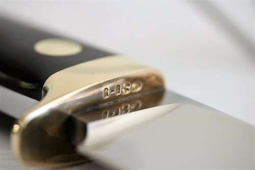 An awesome Piet Cirey "skinning" knife with brass trimmings in its original leather sheath