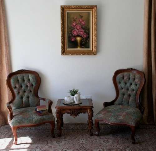 Wow! Magnificent pair of Victorian "king and queen" hand carved chairs with deep button detailing!