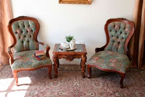 Wow! Magnificent pair of Victorian "king and queen" hand carved chairs with deep button detailing!