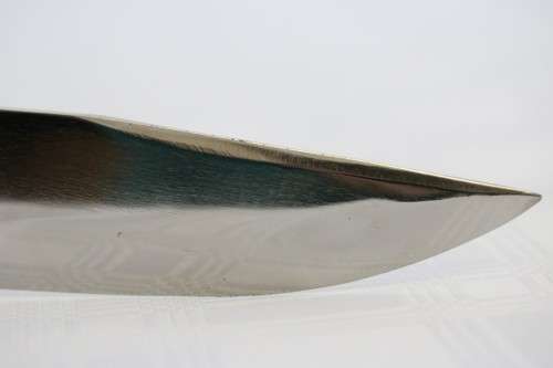 A magnificent hand made in Ecuador TEMPERED STEEL hunting knife in in its original leather sheath!!