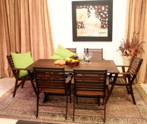 A fabulous modern slatted Teak 6-seater patio/garden set including six cushions.