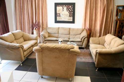 A fantastic, large comfortable four piece Beige lounge suite, perfect in informal lounges!