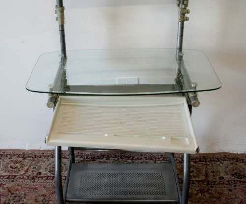 A lovely modern styled silver metal glass top compact computer desk/ stand in good condition