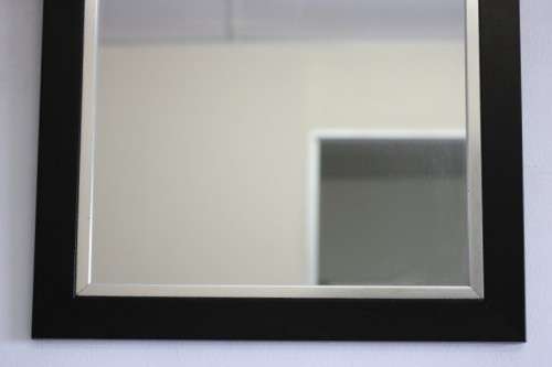 A stylish modern dark wood rectangular wall mirror with brushed steel detailing -  RS17M