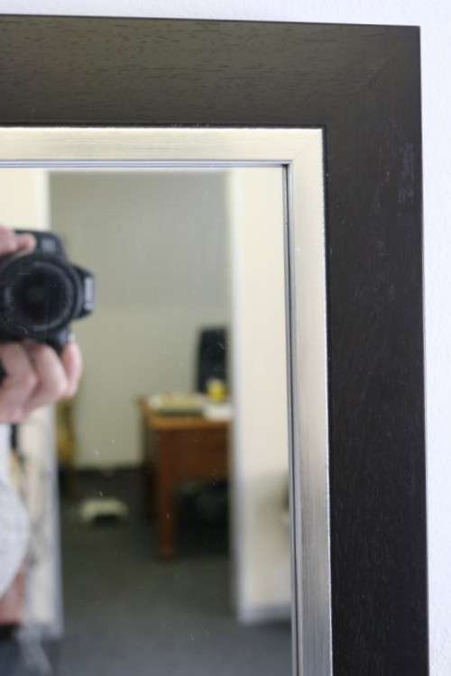 A stylish modern dark wood rectangular wall mirror with brushed steel detailing -  RS17M