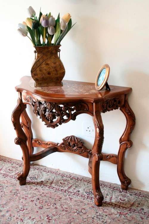 A spectacular antique Victorian half moon occasional/ hallway table with a marble inlay.