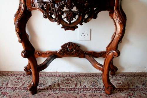 A spectacular antique Victorian half moon occasional/ hallway table with a marble inlay.