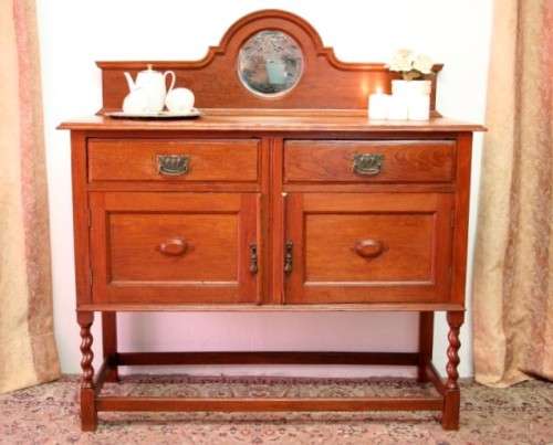 A stunning antique oak side server cabinet with a bevelled mirror, loads of drawer & cupboard space