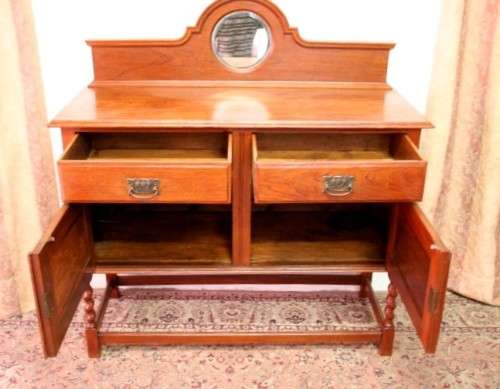 A stunning antique oak side server cabinet with a bevelled mirror, loads of drawer & cupboard space