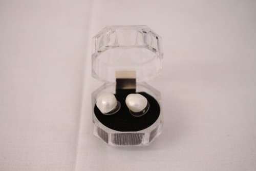 An amazing pair of white cultured baroque pearl earrings in a stunning see-through gift box