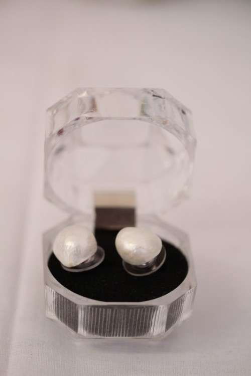 An amazing pair of white cultured baroque pearl earrings in a stunning see-through gift box