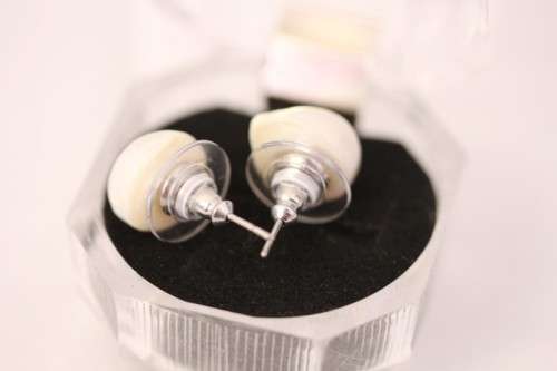 An amazing pair of white cultured baroque pearl earrings in a stunning see-through gift box