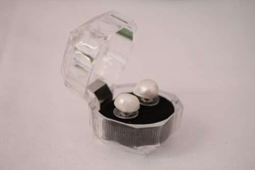 An amazing pair of white cultured baroque pearl earrings in a stunning see-through gift box