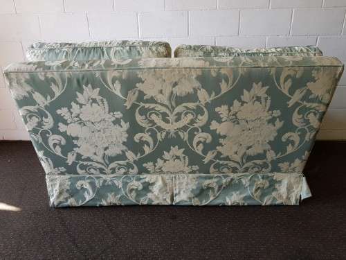 A wonderful "Moorgas & Sons" Brocade fabric couch with cushions & a floral pattern on it