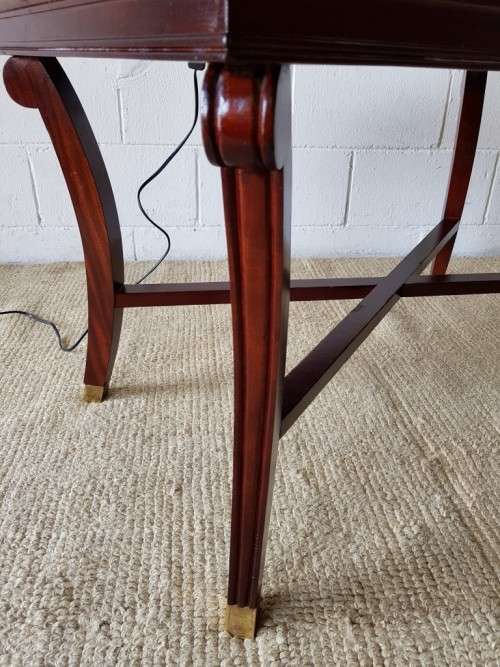 A stylish vintage Mahogany glass-top coffee/ occasional table with Brass feet caps in good condition