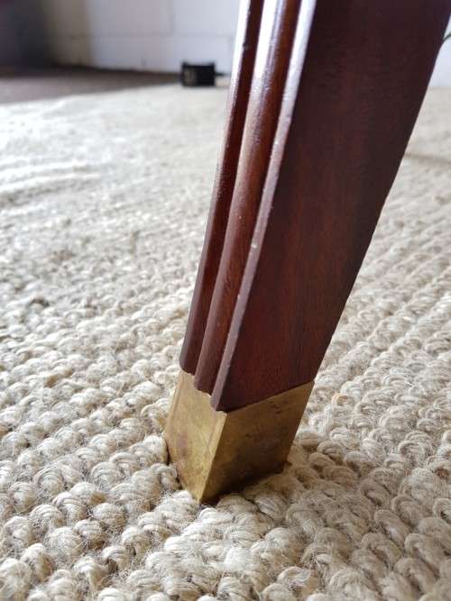 A stylish vintage Mahogany glass-top coffee/ occasional table with Brass feet caps in good condition