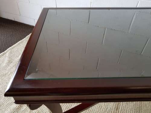 A stylish vintage Mahogany glass-top coffee/ occasional table with Brass feet caps in good condition