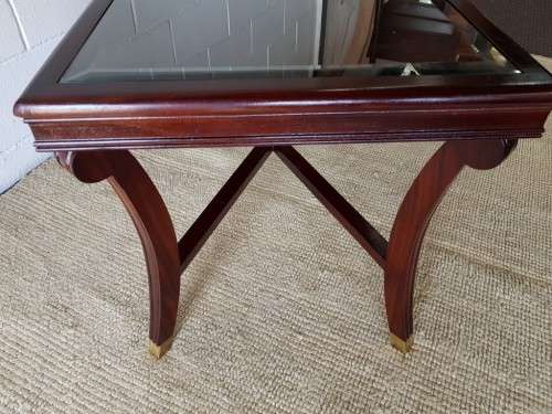 A stylish vintage Mahogany glass-top coffee/ occasional table with Brass feet caps in good condition