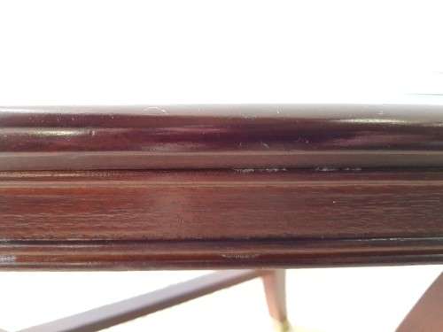 A stylish vintage Mahogany glass-top coffee/ occasional table with Brass feet caps in good condition