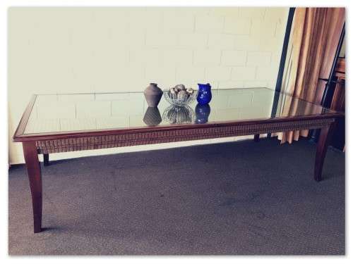 PRICE DRASTICALLY REDUCED!!! A 10-12 seater Mahogany & wicker table with a glass top!