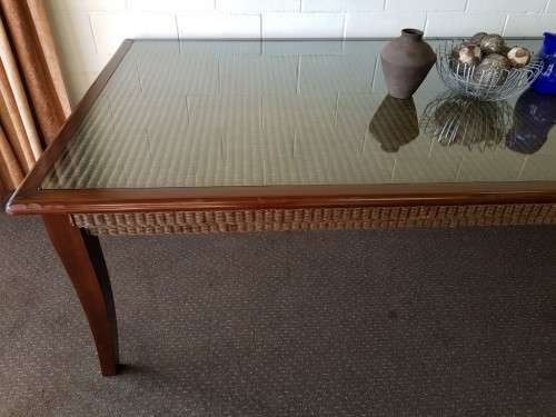 PRICE DRASTICALLY REDUCED!!! A 10-12 seater Mahogany & wicker table with a glass top!
