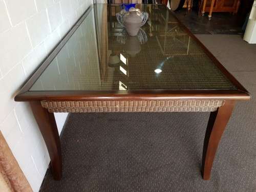 PRICE DRASTICALLY REDUCED!!! A 10-12 seater Mahogany & wicker table with a glass top!