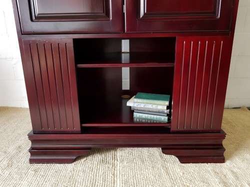 A gorgeous mahogany TV-Cabinet with two doors and ample space for an entertainment system