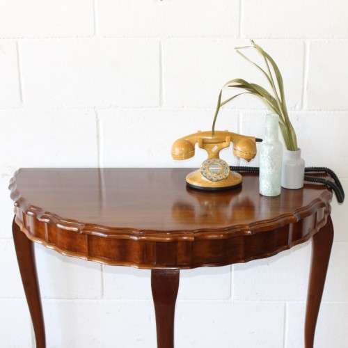 An amazing vintage (larger than normal) Stinkwood ball & claw half moon display/occasional table