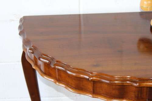 An amazing vintage (larger than normal) Stinkwood ball & claw half moon display/occasional table