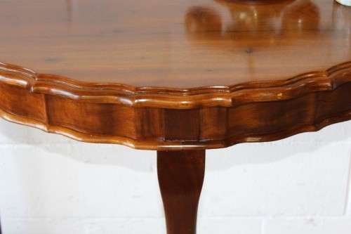 An amazing vintage (larger than normal) Stinkwood ball & claw half moon display/occasional table