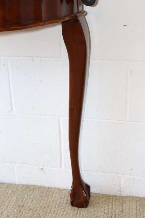 An amazing vintage (larger than normal) Stinkwood ball & claw half moon display/occasional table