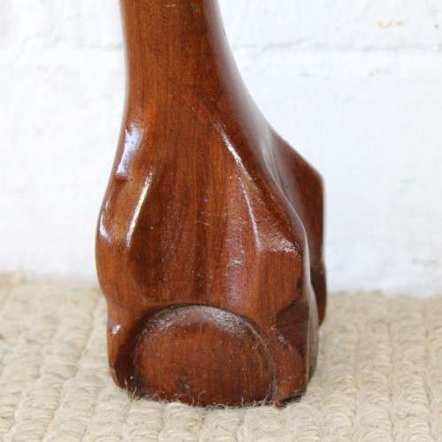 An amazing vintage (larger than normal) Stinkwood ball & claw half moon display/occasional table