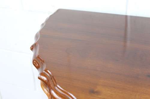 An amazing vintage (larger than normal) Stinkwood ball & claw half moon display/occasional table