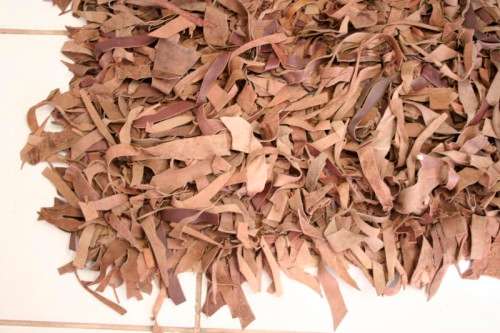**RS17** A striking and unusual shaggy-leather carpet in shades of brown colours
