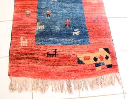 A fabulous thick pile colourful carpet in shades of red and blue colours.