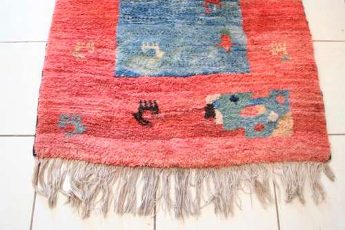A fabulous thick pile colourful carpet in shades of red and blue colours.