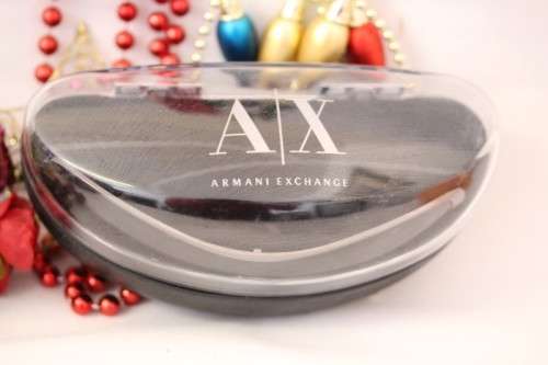 An incredible pair of black Armani Exchange (model AX008NS) unisex sunglasses in its original box