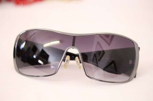 An incredible pair of black Armani Exchange (model AX008NS) unisex sunglasses in its original box