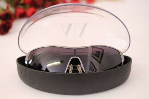 An incredible pair of black Armani Exchange (model AX008NS) unisex sunglasses in its original box