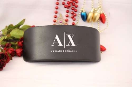 **rs17** A pair of black Armani Exchange (model AX2007) unisex sunglasses in its original case