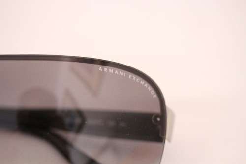 **rs17** A pair of black Armani Exchange (model AX2007) unisex sunglasses in its original case
