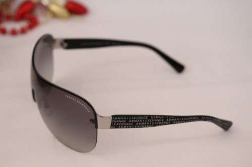 **rs17** A pair of black Armani Exchange (model AX2007) unisex sunglasses in its original case