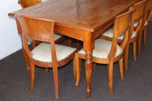 A magnificent Balinese Teak 8-seater dining suite with stylish upholstered curved-back chairs