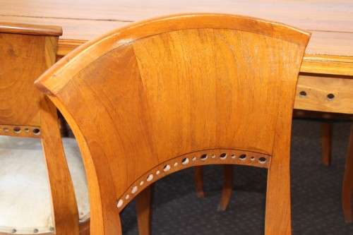 A magnificent Balinese Teak 8-seater dining suite with stylish upholstered curved-back chairs