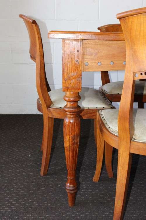 A magnificent Balinese Teak 8-seater dining suite with stylish upholstered curved-back chairs