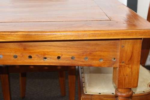 A magnificent Balinese Teak 8-seater dining suite with stylish upholstered curved-back chairs