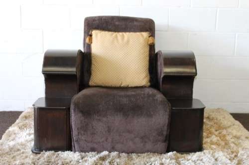An incredible and rare Art Deco "club" armchair with drinks-rest in a rich chocolate brown fabric